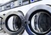 row of industrial commercial laundry machines min 1