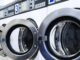 row of industrial commercial laundry machines min