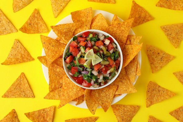 pico de gallo and chips on yellow background 2021 09 04 16 27 34 utc